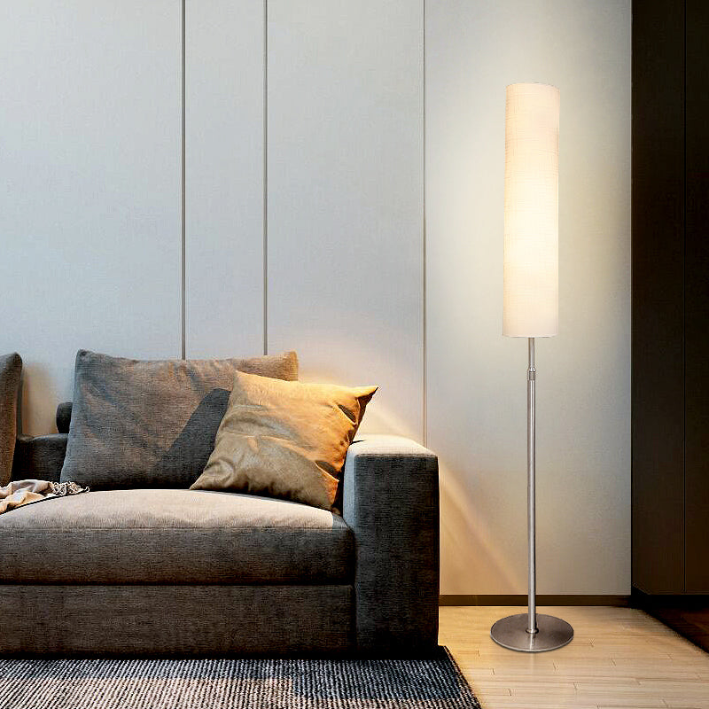 White cylindrical floor lamp 180cm with pleated fabric shade and metal base, minimalist indoor lighting