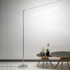 Minimalist linear LED floor lamp in metal and acrylic, modern streamline design, 2 colour options
