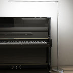 Minimalist linear LED floor lamp in metal and acrylic, modern streamline design, 2 colour options