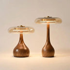 Table lamp with solid walnut timber base and tinted glass disc, warm ambient LED light