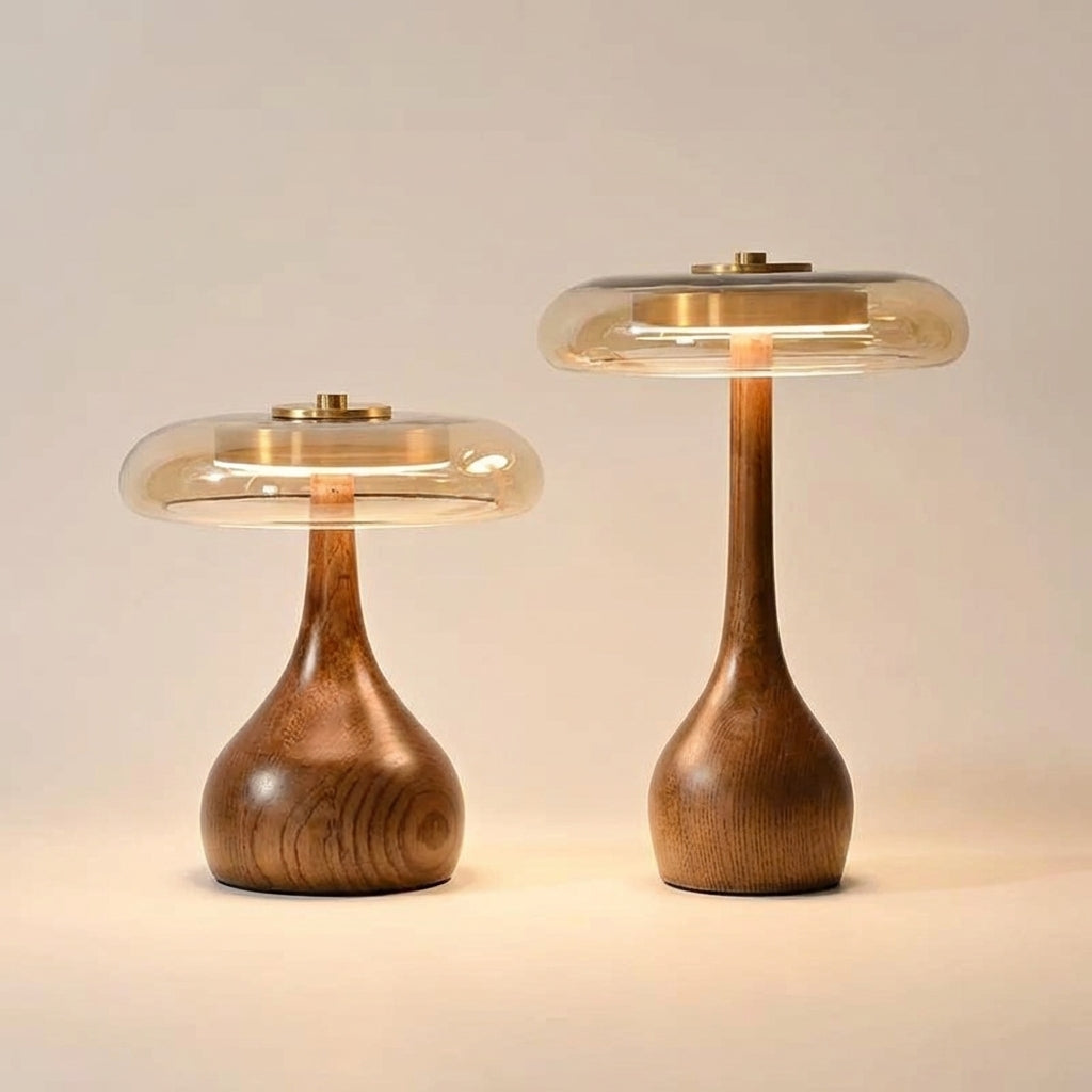 Table lamp with solid walnut timber base and tinted glass disc, warm ambient LED light