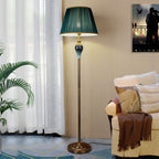 Floor lamp with fabric dome shade and metal base, available in multi colour options for bedroom