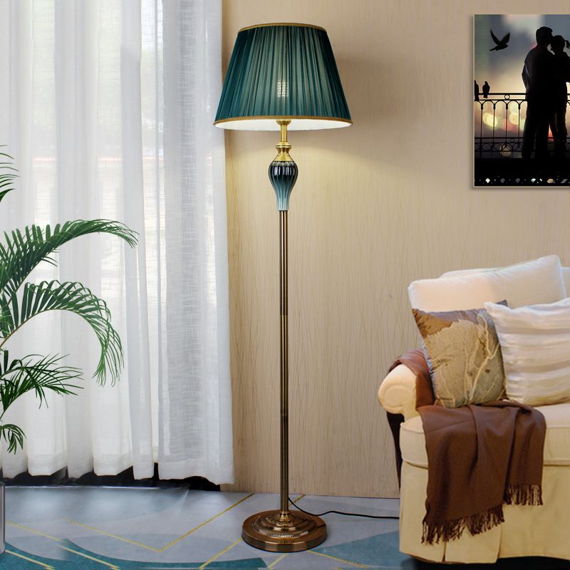 Floor lamp with fabric dome shade and metal base, available in multi colour options for bedroom