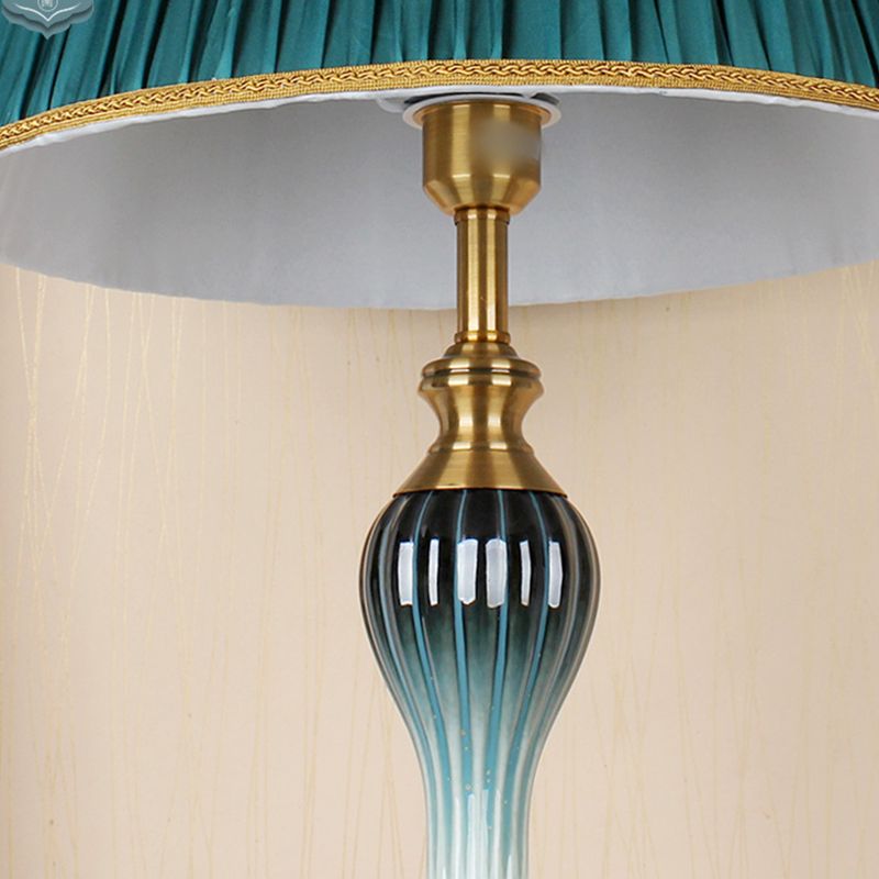 Floor lamp with fabric dome shade and metal base, available in multi colour options for bedroom