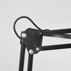 Adjustable LED table lamp with clip-on base and flexible arm, minimalist metal design