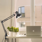 Adjustable LED table lamp with clip-on base and flexible arm, minimalist metal design