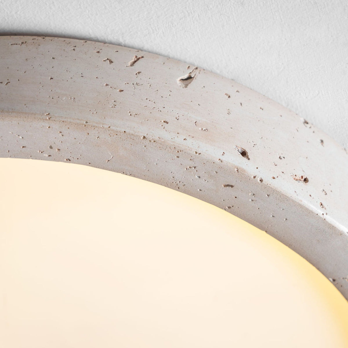 Flush mount ceiling light with travertine finish, slim profile, round LED, three sizes