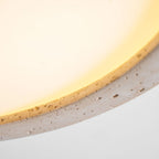 Flush mount ceiling light with travertine finish, slim profile, round LED, three sizes