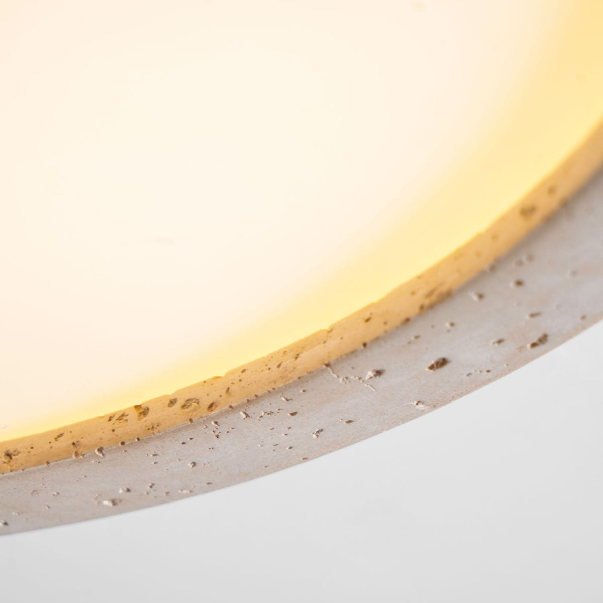 Flush mount ceiling light with travertine finish, slim profile, round LED, three sizes