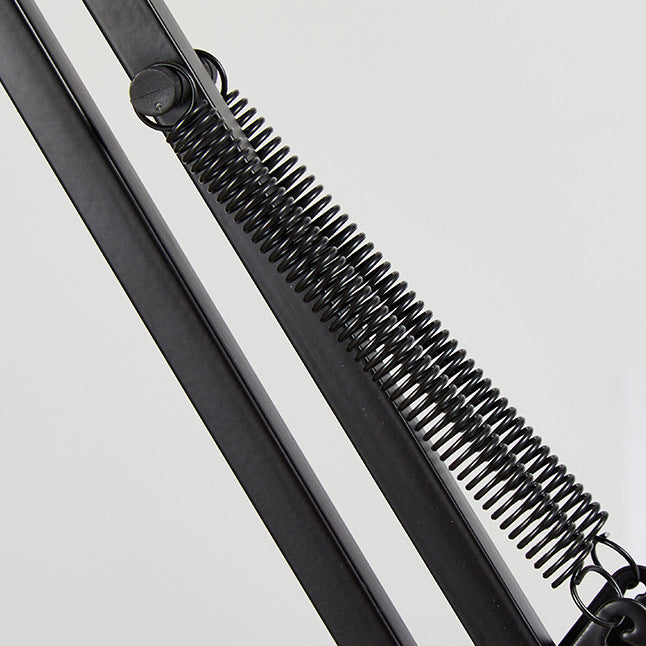 Adjustable LED table lamp with clip-on base and flexible arm, minimalist metal design