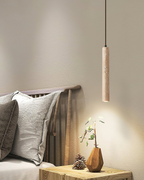 Travertine pendant light minimalist cylinder natural stone warm ambient glow