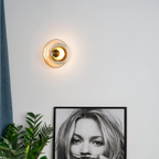 Round wall sconce with brass and glass shade, minimalist LED 1-light indoor fixture