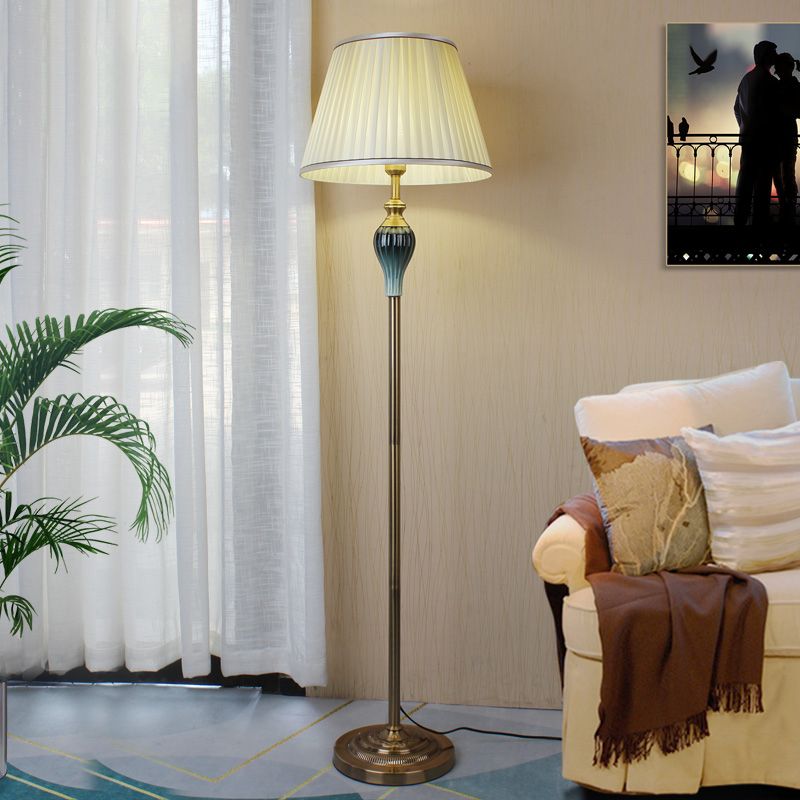 Floor lamp with fabric dome shade and metal base, available in multi colour options for bedroom