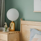 Hand-blown glass table lamp Nordic style, frosted globe on metal base, gold and black finish