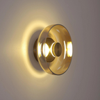 Round wall sconce with brass and glass shade, minimalist LED 1-light indoor fixture
