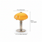 Mushroom table lamp with warm amber glow, cast iron frame and hand-blown glass shade