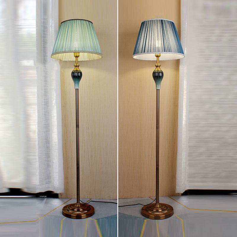 Floor lamp with fabric dome shade and metal base, available in multi colour options for bedroom