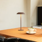 Cordless table lamp in solid iron with touch control and warm white LED