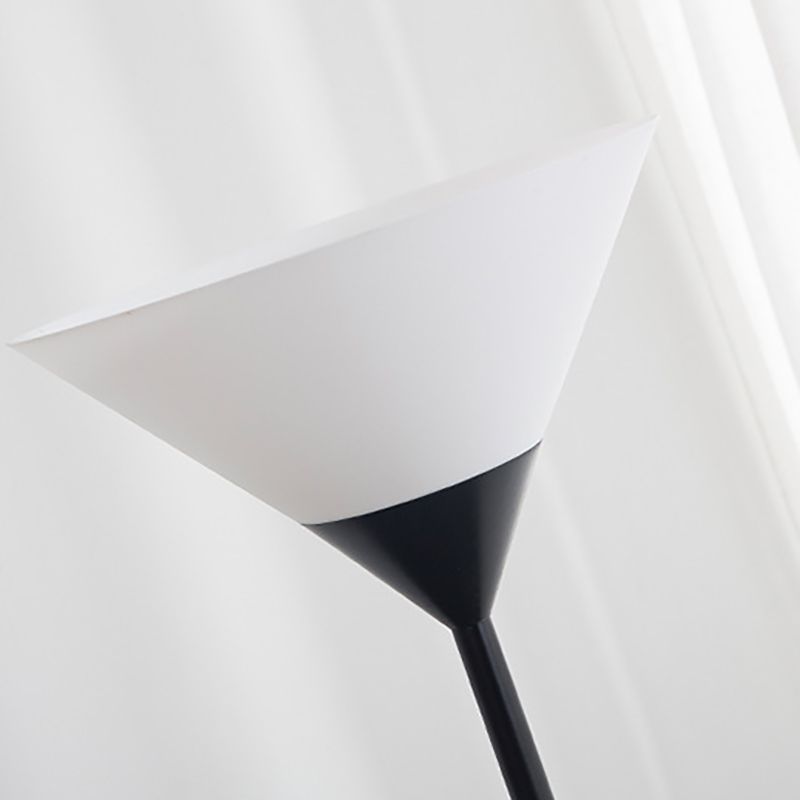 Floor lamp with cup-shaped acrylic shade and metal pole, minimalist multi-colour design