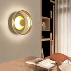 Round wall sconce with brass and glass shade, minimalist LED 1-light indoor fixture