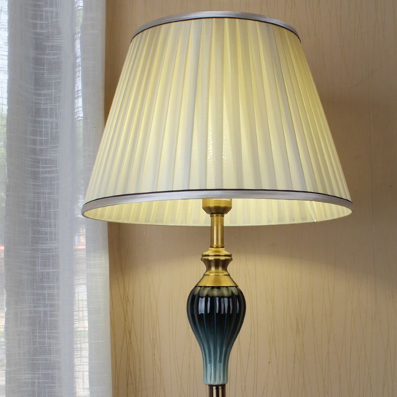 Floor lamp with fabric dome shade and metal base, available in multi colour options for bedroom