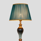 Floor lamp with fabric dome shade and metal base, available in multi colour options for bedroom