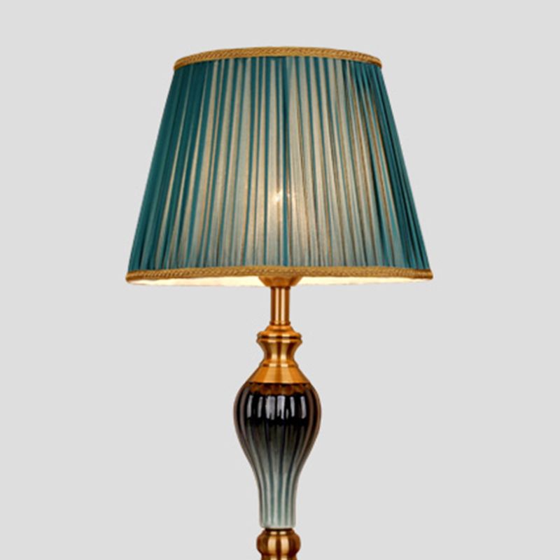 Floor lamp with fabric dome shade and metal base, available in multi colour options for bedroom