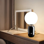 Hand-blown glass table lamp Nordic style, frosted globe on metal base, gold and black finish