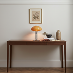 Mushroom table lamp with warm amber glow, cast iron frame and hand-blown glass shade