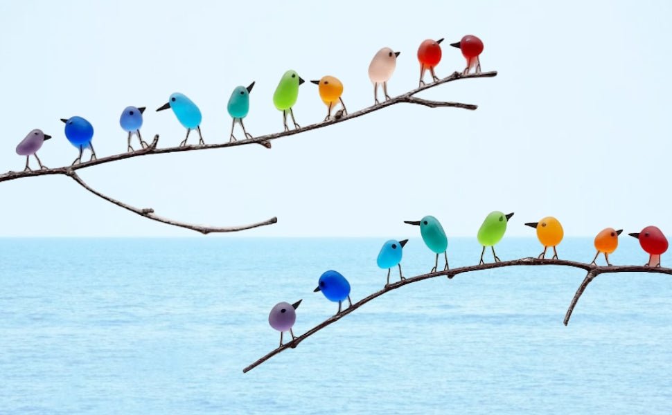 Sea glass wall art with colorful rainbow birds on a wooden branch, recycled material