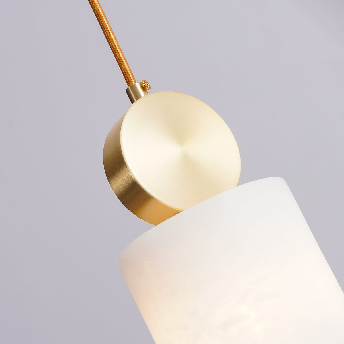 Alabaster pendant light with brass fitting and G9 socket, natural stone shade