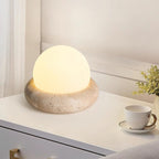 Travertine table lamp with opal glass globe, beige natural stone base, USB rechargeable LED