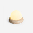 Travertine table lamp with opal glass globe, beige natural stone base, USB rechargeable LED