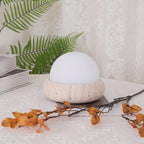 Travertine table lamp with opal glass globe, beige natural stone base, USB rechargeable LED