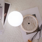 Travertine table lamp with opal glass globe, beige natural stone base, USB rechargeable LED