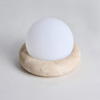 Travertine table lamp with opal glass globe, beige natural stone base, USB rechargeable LED