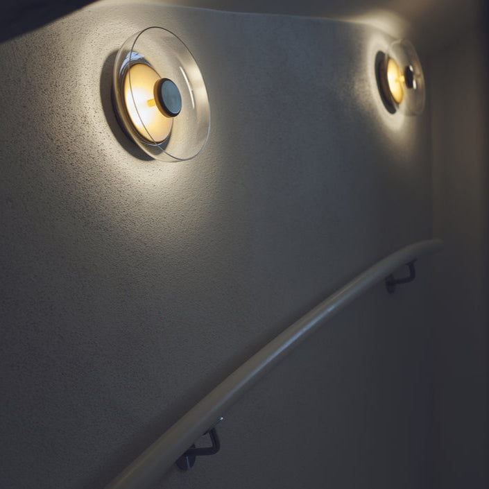 Round wall sconce with brass and glass shade, minimalist LED 1-light indoor fixture