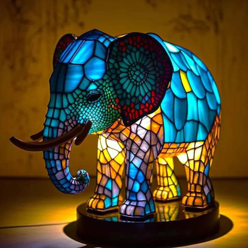 Stained glass animal table lamp with vibrant coloured glass panels and warm ambient light