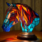 Stained glass animal table lamp with vibrant coloured glass panels and warm ambient light