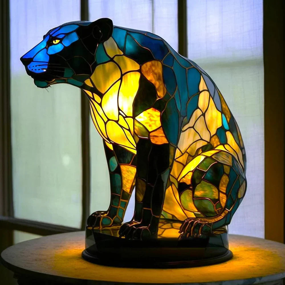 Stained glass animal table lamp with vibrant coloured glass panels and warm ambient light