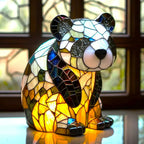 Stained glass animal table lamp with vibrant coloured glass panels and warm ambient light