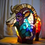 Stained glass animal table lamp with vibrant coloured glass panels and warm ambient light