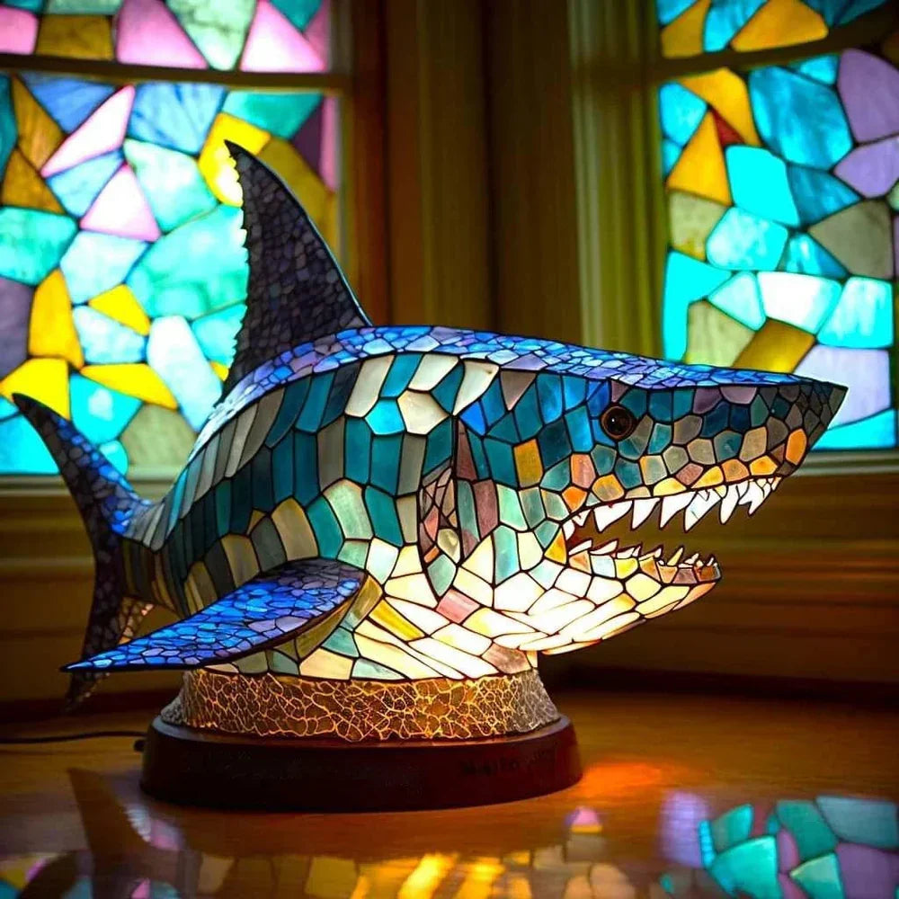 Stained glass animal table lamp with vibrant coloured glass panels and warm ambient light