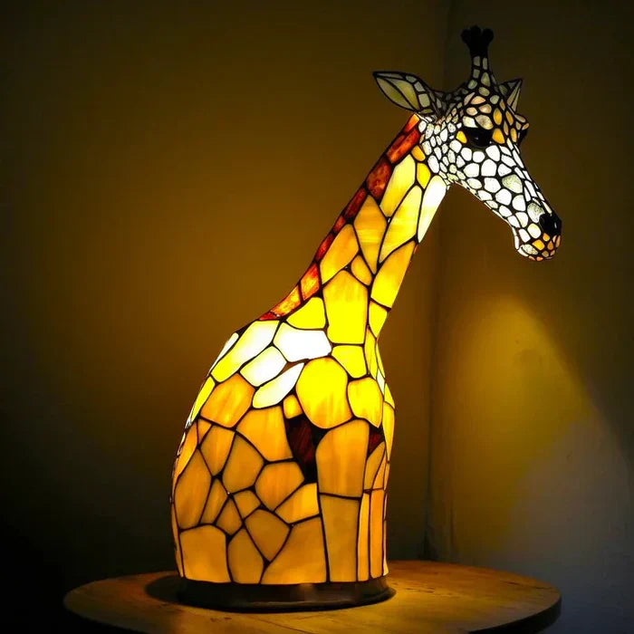 Stained glass animal table lamp with vibrant coloured glass panels and warm ambient light