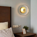 Round wall sconce with brass and glass shade, minimalist LED 1-light indoor fixture