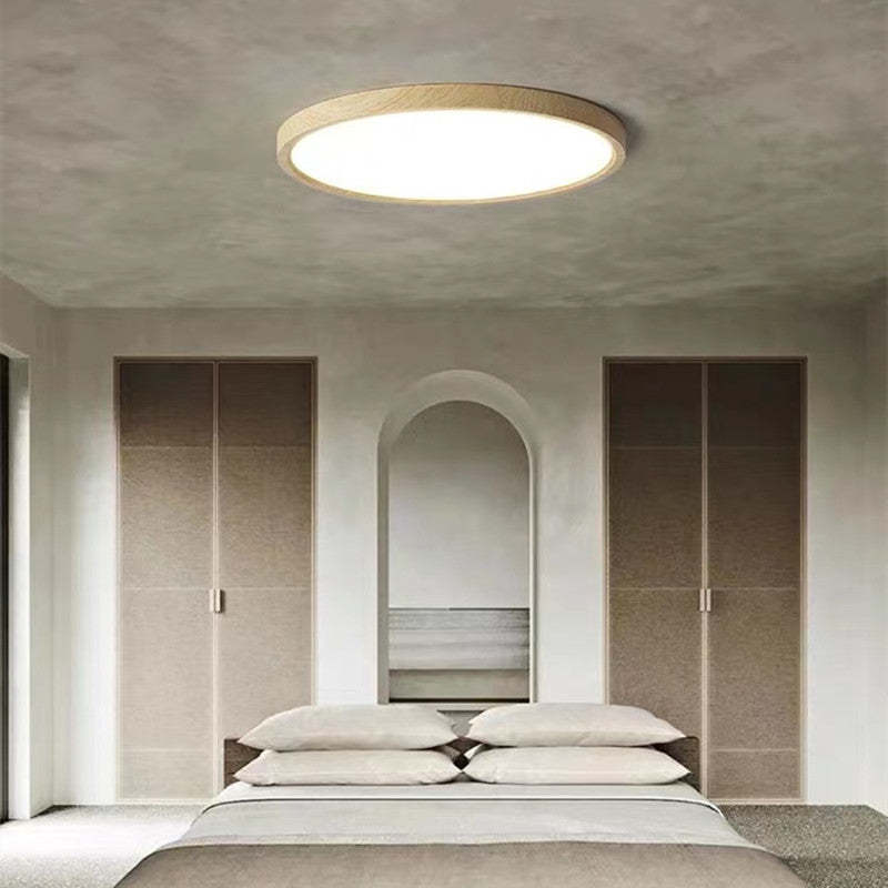Slim round LED ceiling light with Japanese-inspired wood accent finish, flush mount