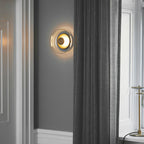 Round wall sconce with brass and glass shade, minimalist LED 1-light indoor fixture