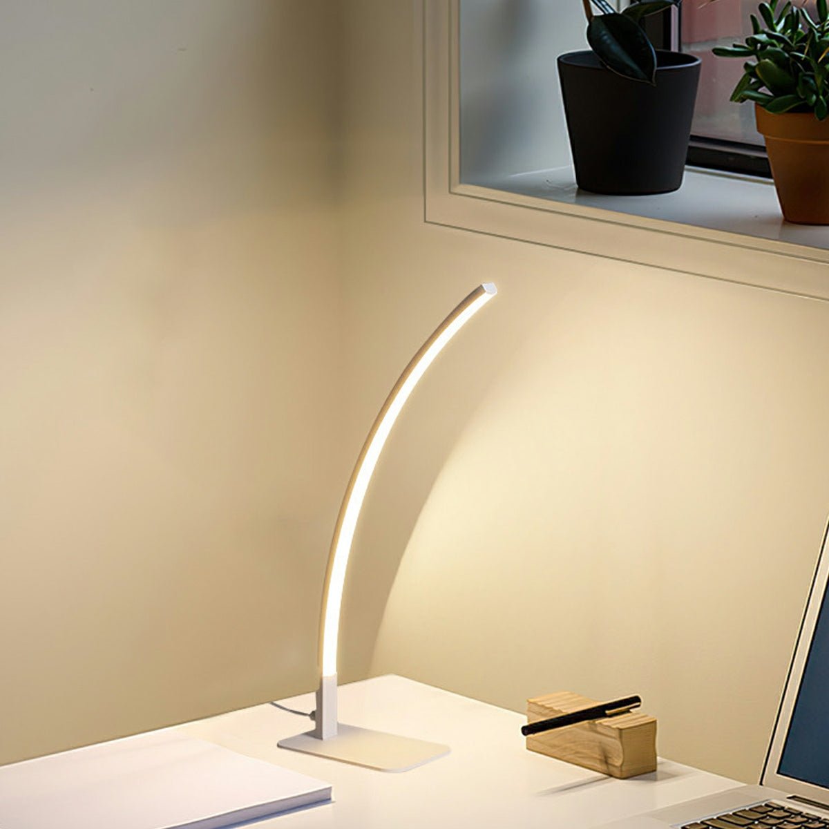 Arc LED dimmable table lamp in black or white, modern minimalist design, 3000K–6000K