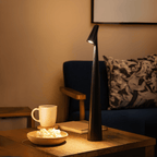 Rechargeable table lamp with cordless dimmable LED and metal and glass design