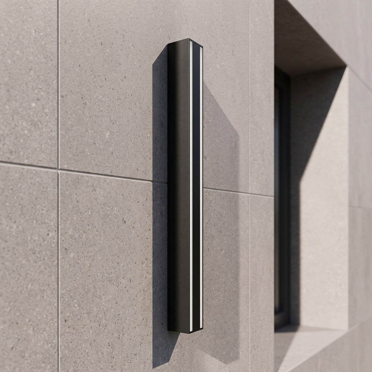 Linear outdoor wall light in black aluminium with warm LED up-down wall wash effect
